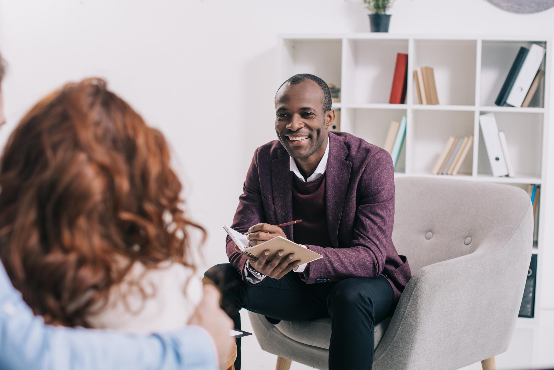 male therapist talking to patient