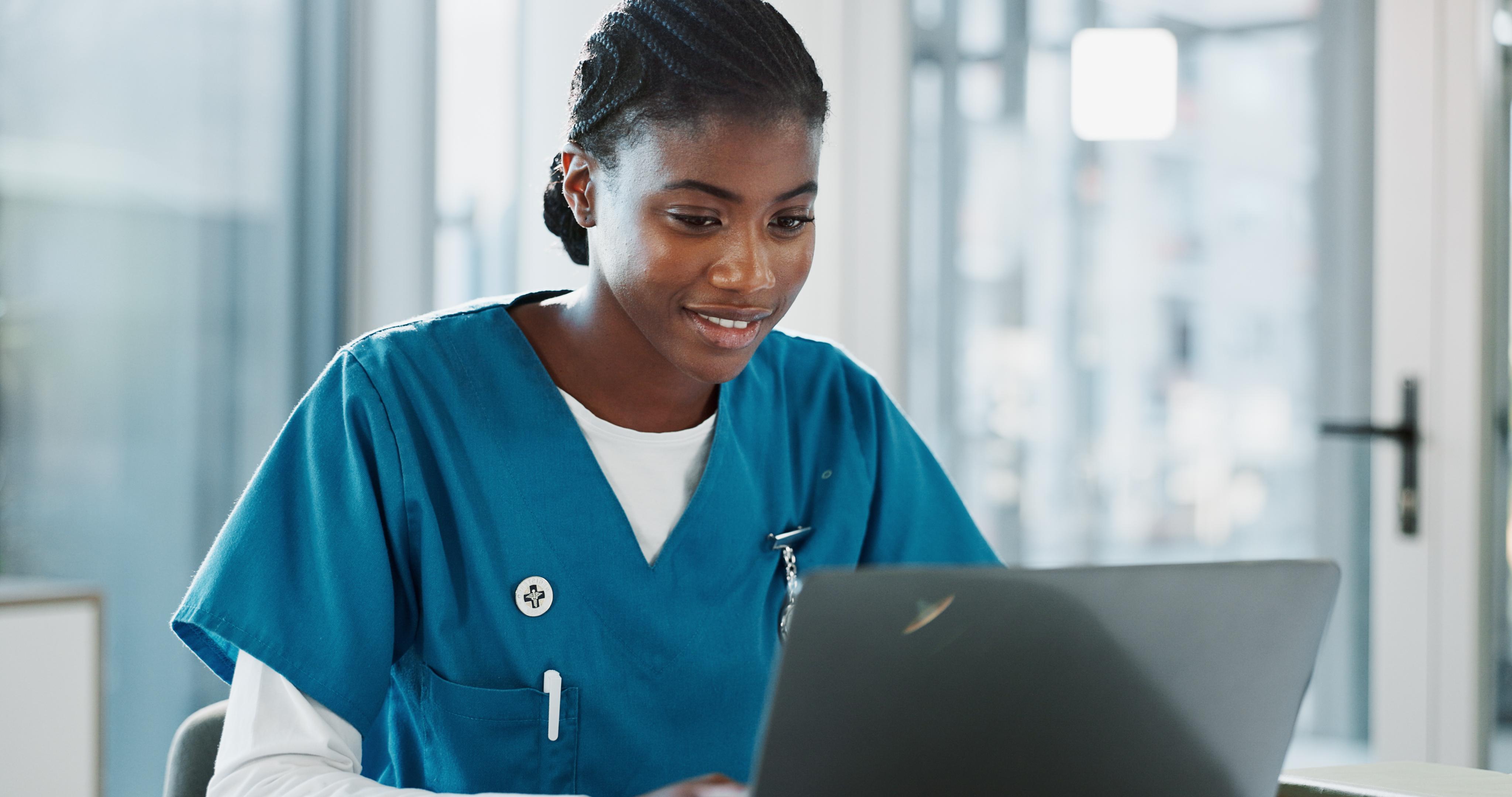 Nurse looking at a laptop